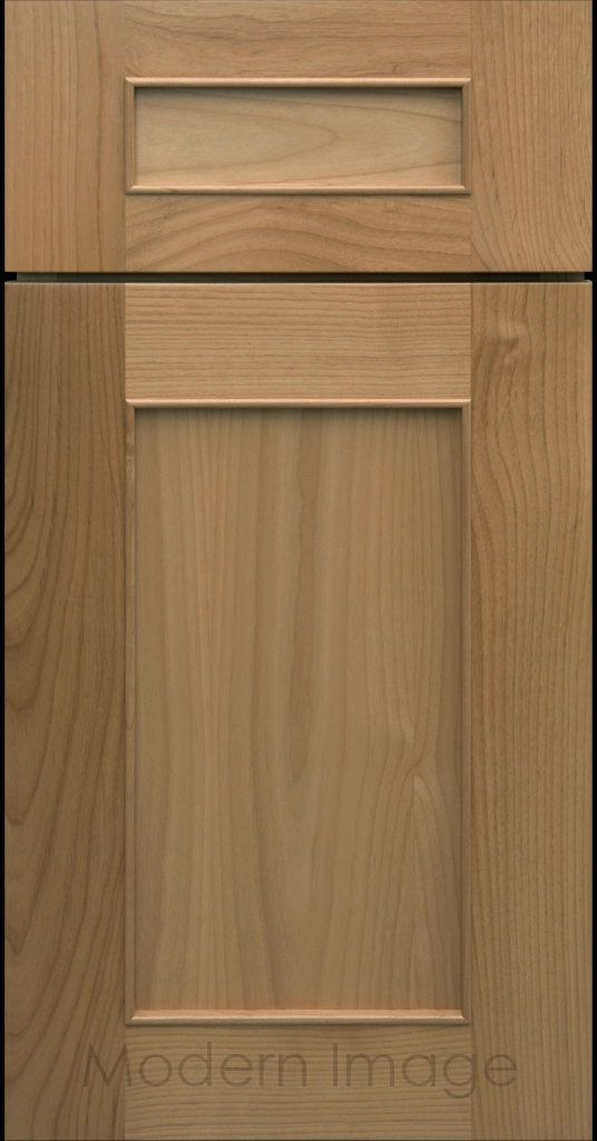 Detail view of a Chandler Shaker cabinet door in Honey stain with raised molding along the inner panel.